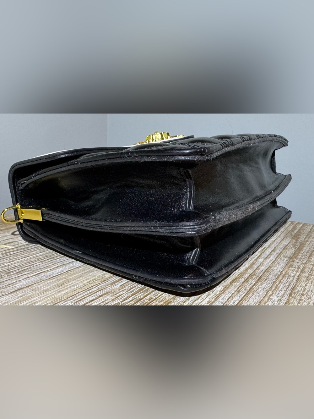 White and Black Quilted Top-Handle Bag with Gold Emblem - Picture 8 of 11